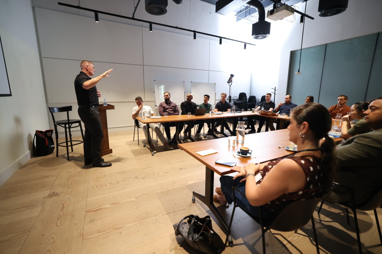 Shane Shackleton presenting to a seated group in a workshop setting